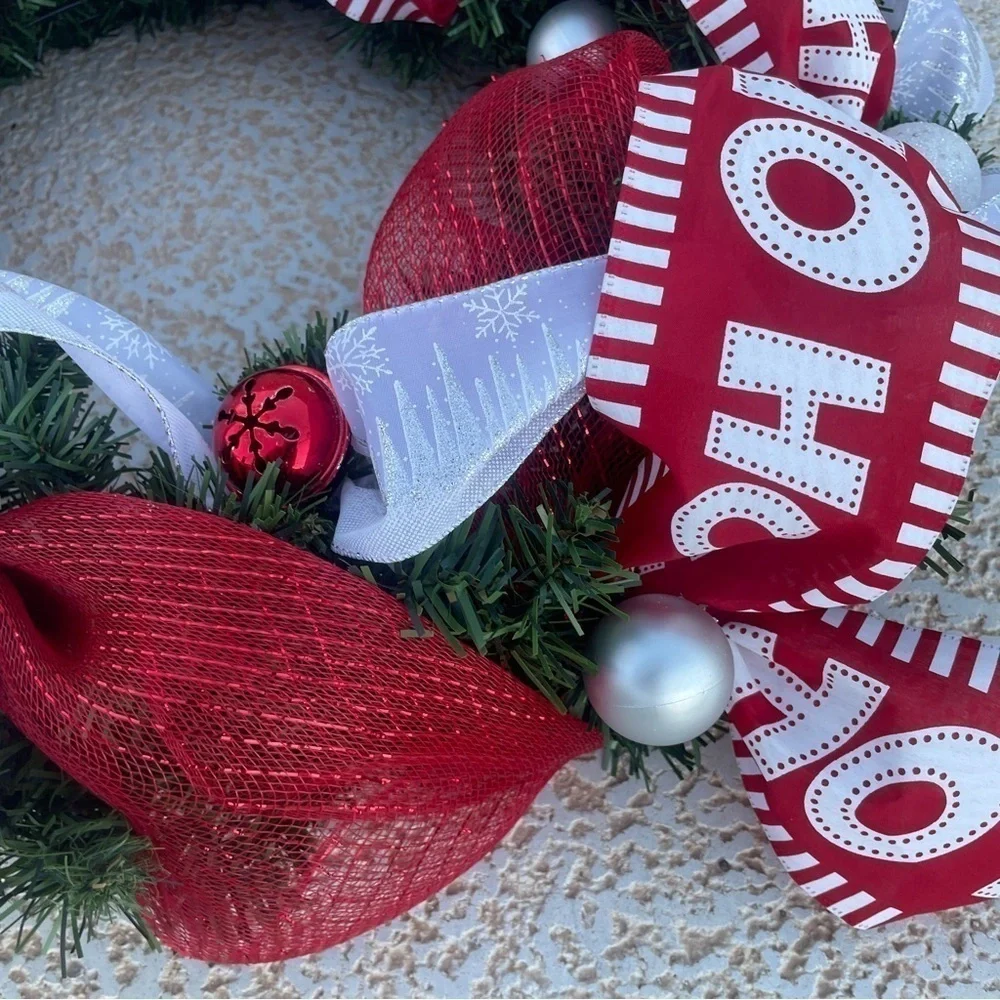 Handmade Christmas wreath, ribbon,bells, and ornaments. Silver, white and red